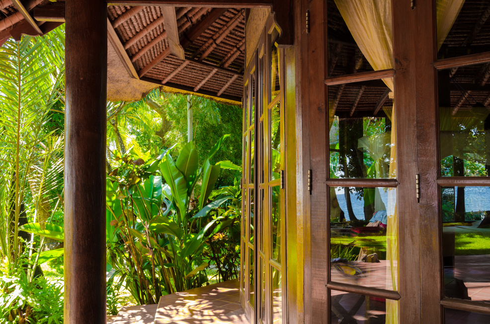 Bali Indonesia - Resort with beautiful bungalow,  ocean view and palms in village Tejakula